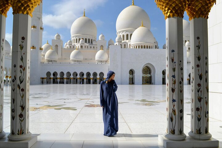 Step into the majestic beauty of Abu Dhabi's Sheikh Zayed Mosque where intricate architecture meets serene reflections inviting exploration and cultural appreciation amidst stunning surroundings.